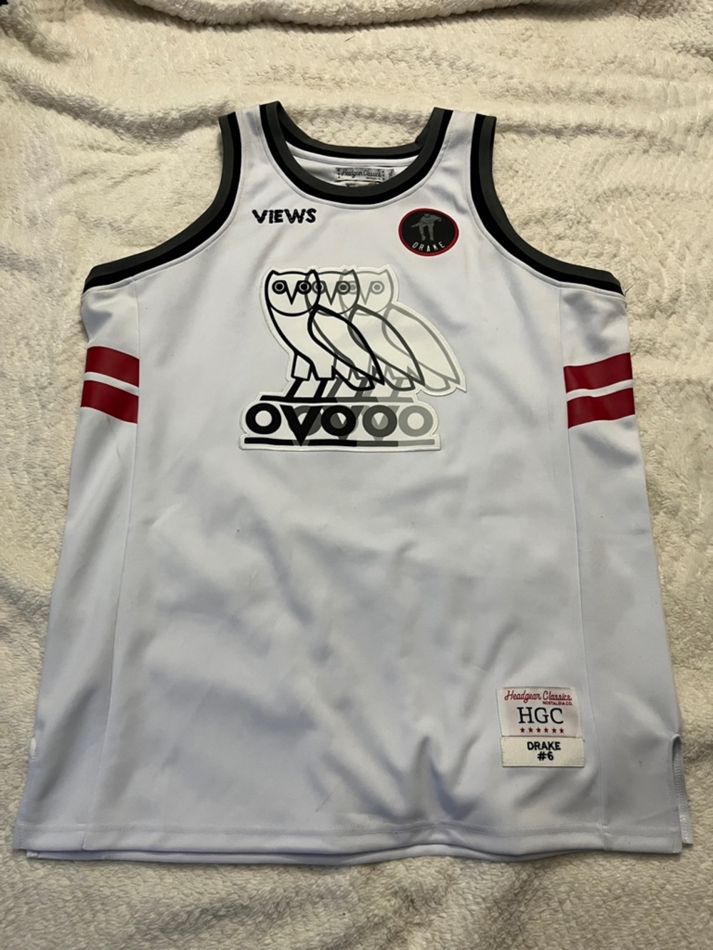 OVO White Basketball Jersey with Black Trim and Red Sleeve Stripes